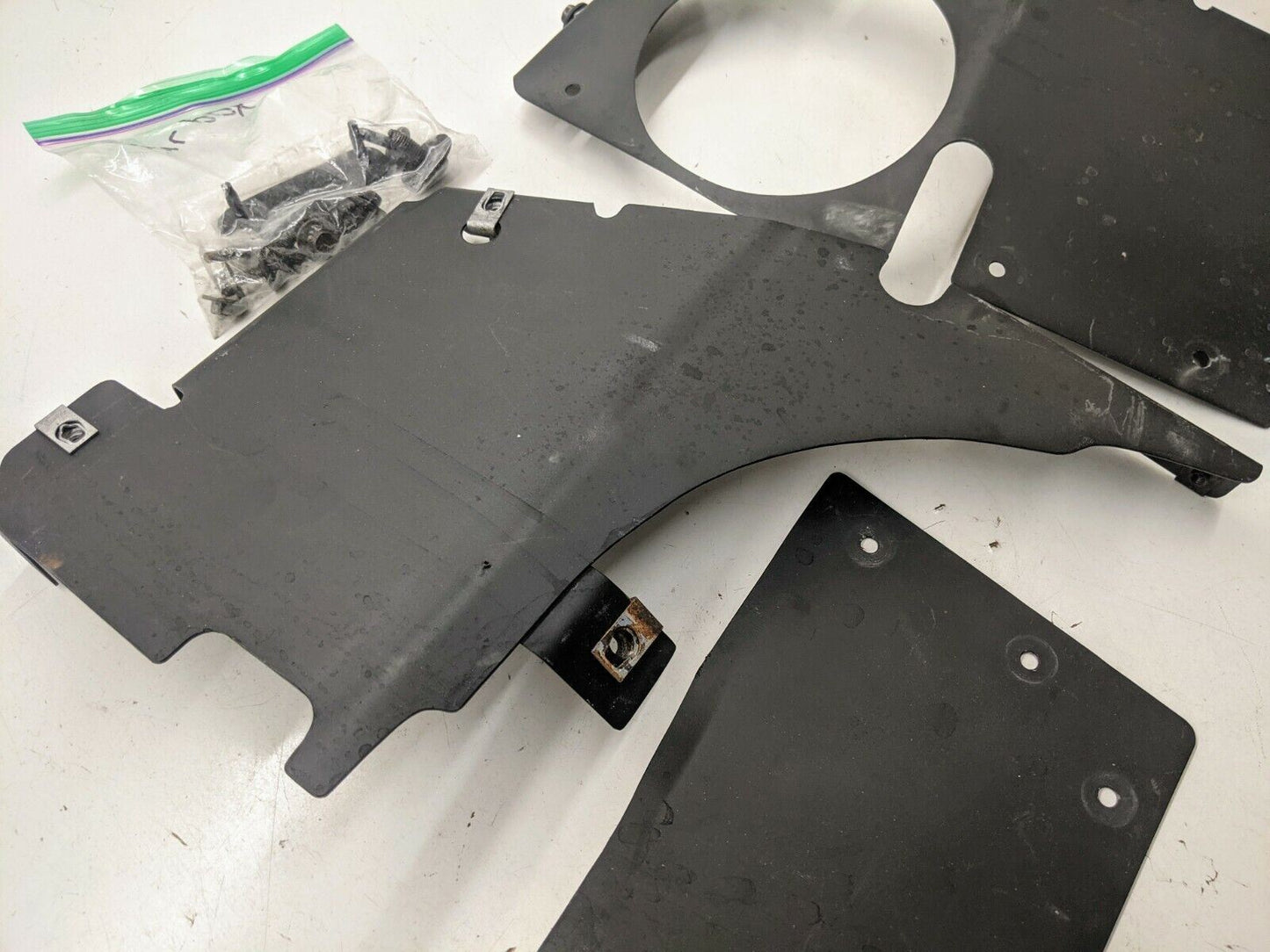 The Ugly Truckling 1995-2005 Chevy S10 Blazer LS Swap Cold Air Box Custom Fabricated Factory Look is shown with mounting holes, brackets, and a bag of assorted screws and fasteners on a white surface.