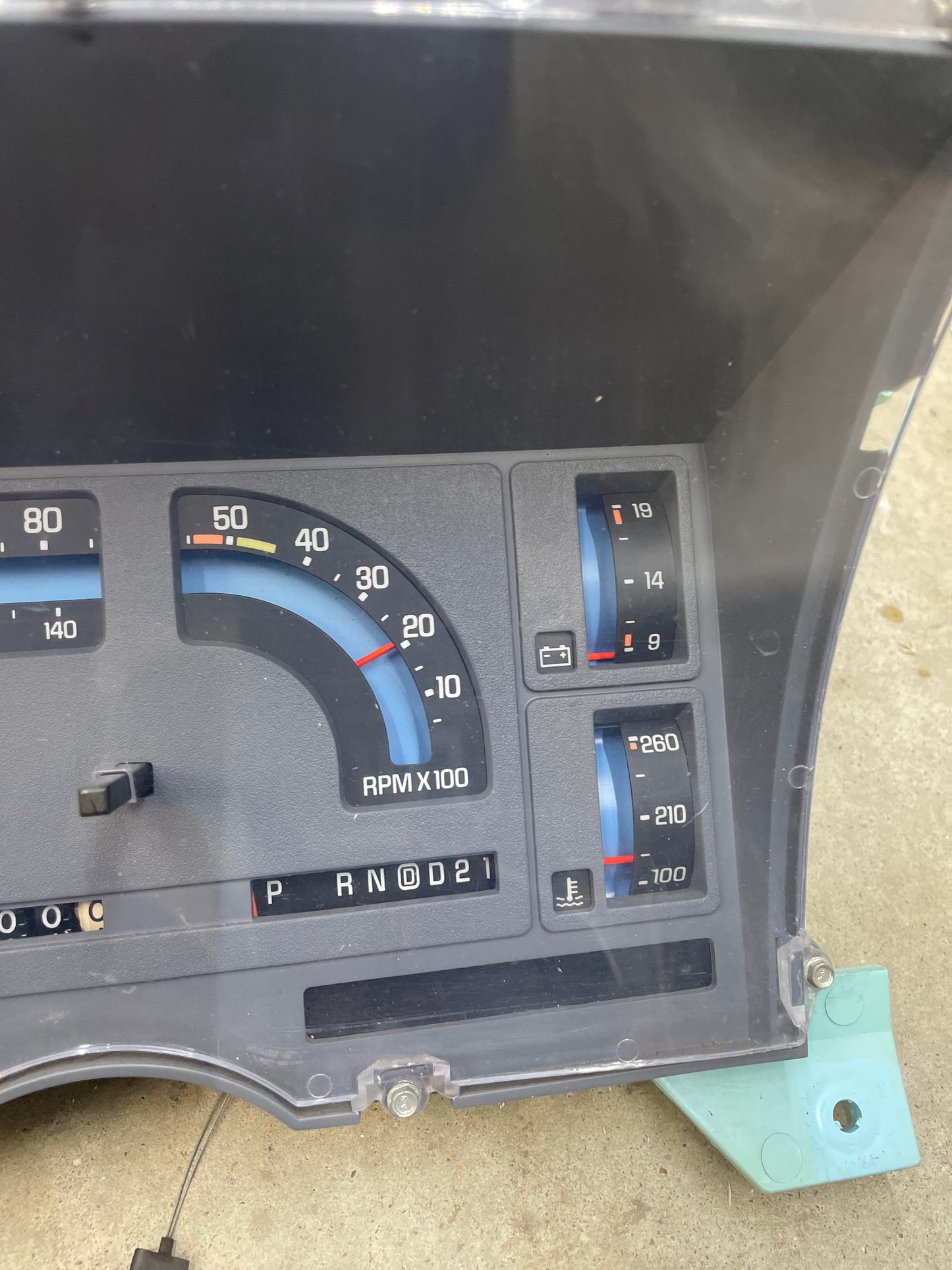A close-up of the General Motors LOW Mile 72K OEM Instrument Cluster for 1986-1989 Chevy S10 Blazer shows the mechanical speedo, tachometer, PRNDL, and various gauges. The panel is removed from the vehicle.