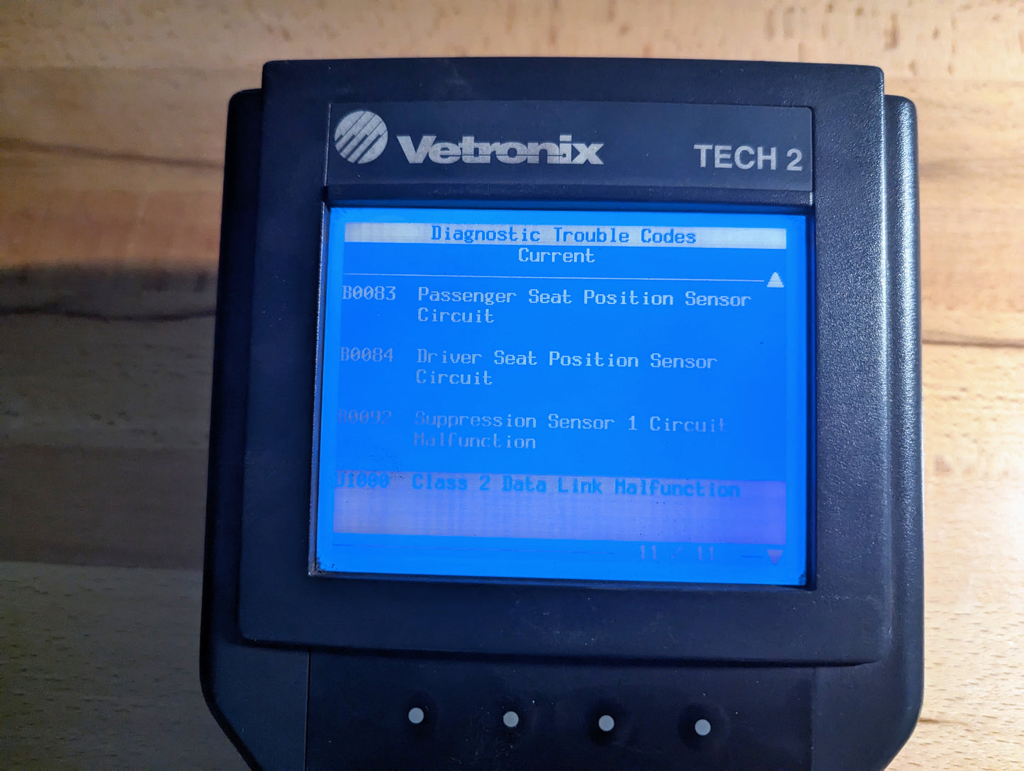 The Vetronix TESTED Tech 2 Automotive Diagnostic Tool & Accessories for 1991-2013 GM vehicles shows trouble codes, including seat position sensor circuit, suppression sensor issues, and data link malfunctions.