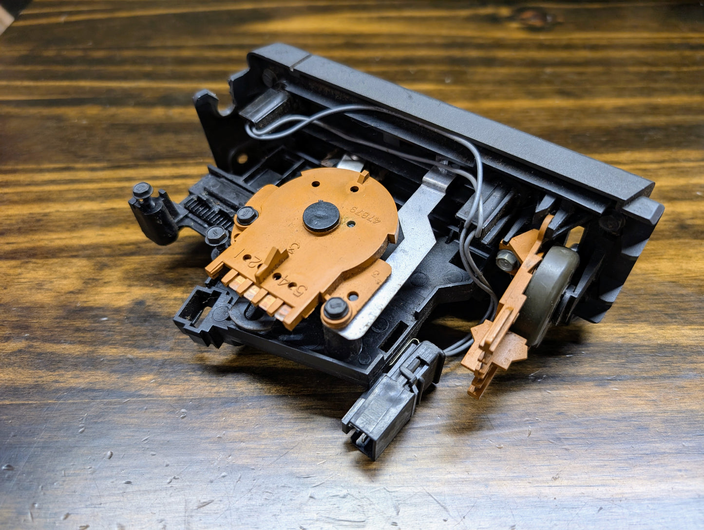 A close-up of a General Motors HVAC Heater Control Panel with A/C for 1986-1994 Chevrolet S10 and Blazer showcases its exposed components, echoing the classic design elements found in these iconic vehicles.