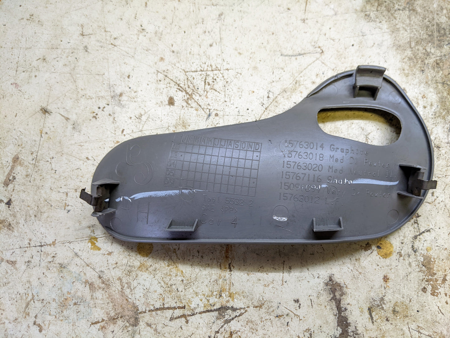 OEM Rear Passenger Door Handle Trim Cup in Light Gray for 2003-2006 Chevy Silverado, Tahoe, Suburban, and more