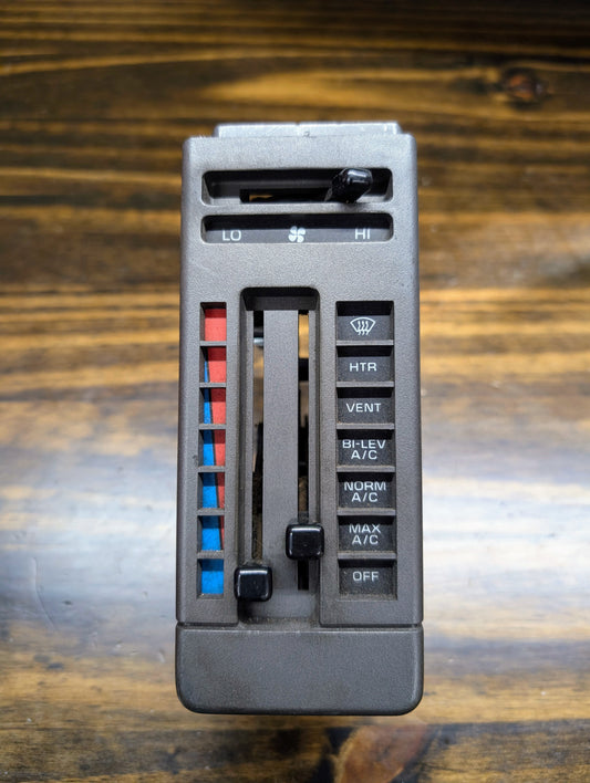 A close-up of the General Motors HVAC Heater Control Panel with A/C for 1986–1994 Chevrolet S10, Blazer, and more shows sliders for temperature and fan speed, buttons for HTR, VENT, BI-LEV A/C, NORM A/C, MAX A/C, OFF, plus red/blue temperature bars.