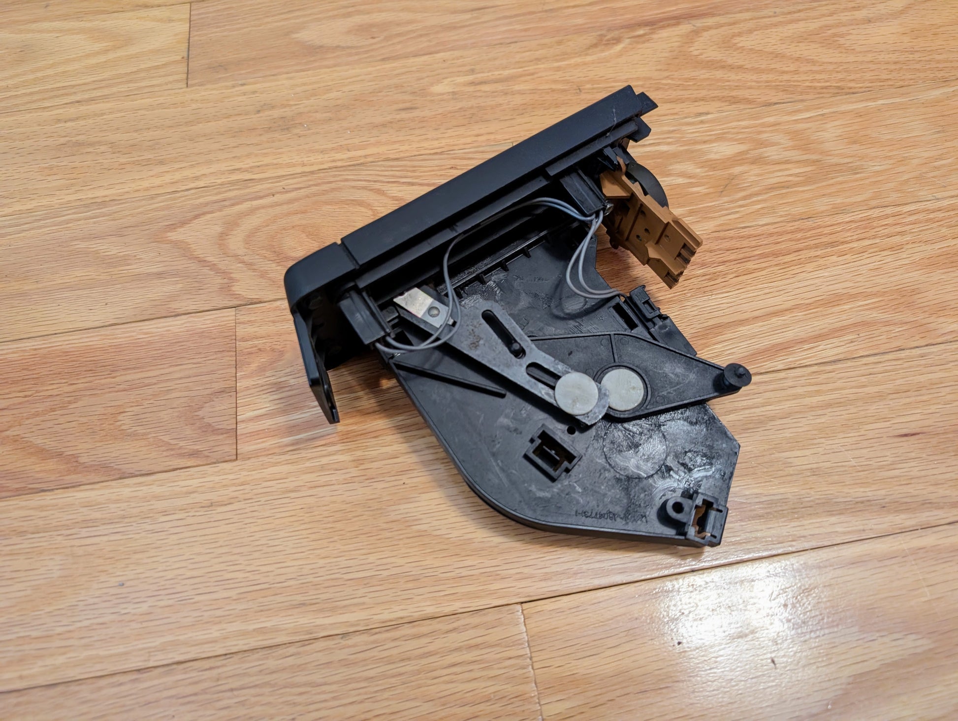 A General Motors RARE HVAC Heater Control Panel OEM (no A/C, no vent) for 1986-1994 Chevrolet S10 and Blazer sits on a light wood floor.